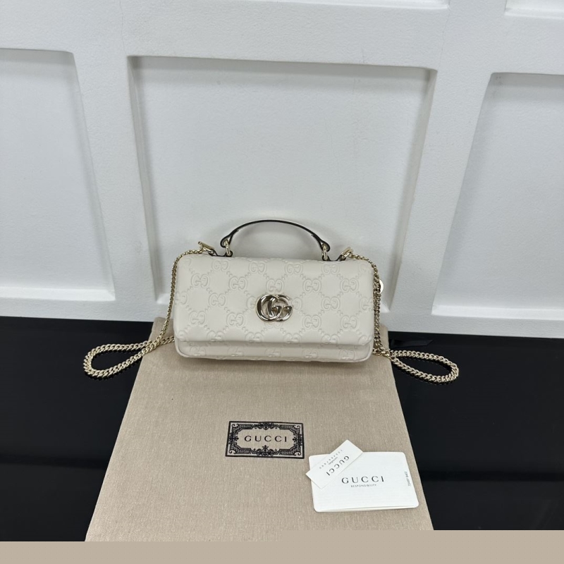 G*u*i top handle bags